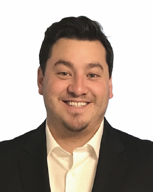 Smiling man in suit against white background.