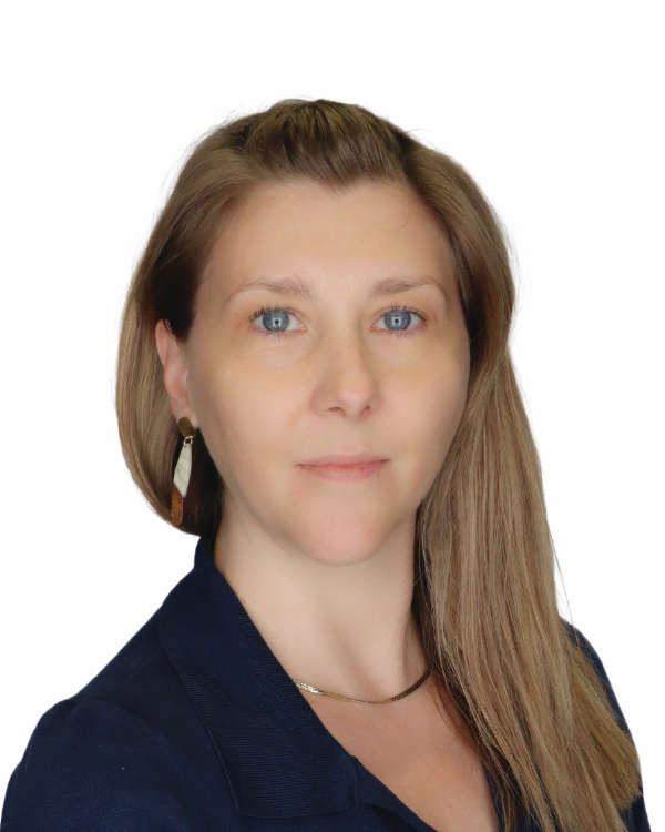 Smiling woman with long hair, white background.