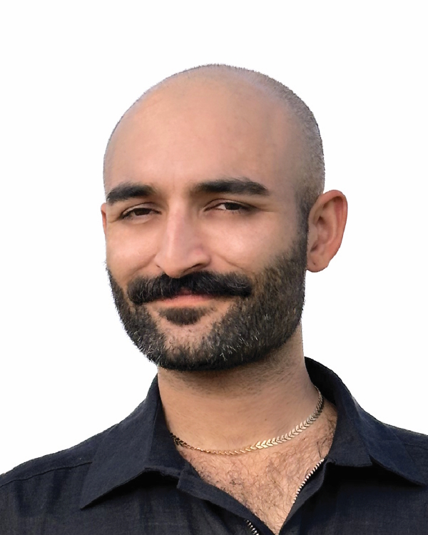 Smiling man with a mustache and beard.