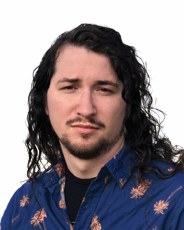 Man with long hair in a blue shirt.